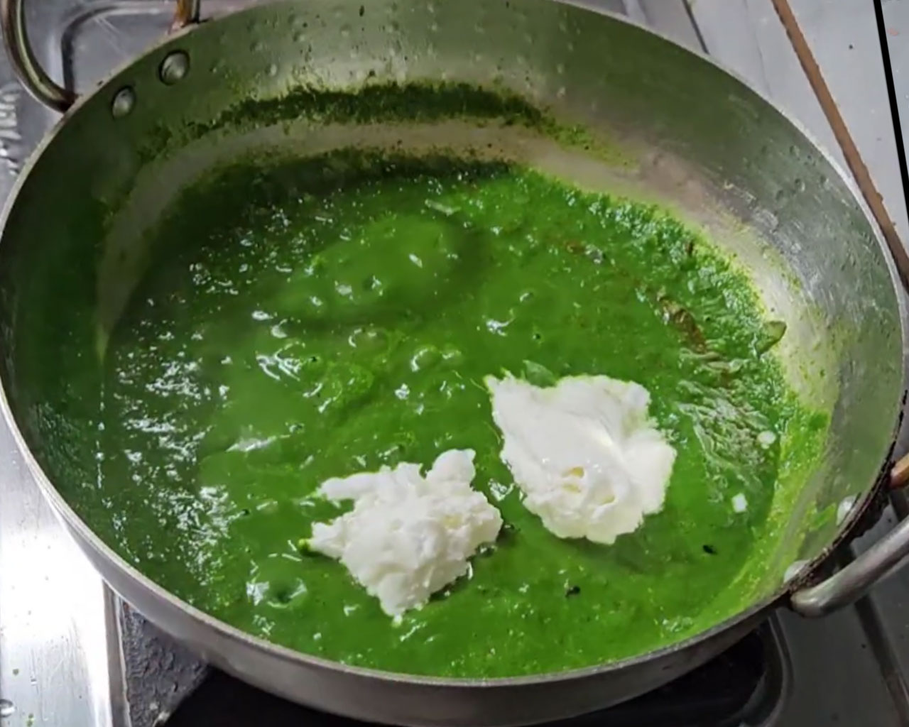 Fresh cream added to the spinach gravy while making Palak Paneer
