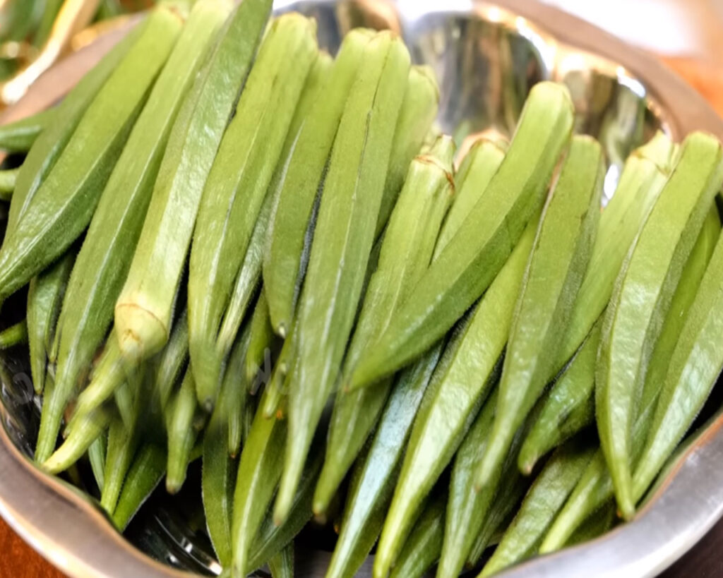 Fresh bhindi in a steel bowl for bhindi masala preparation