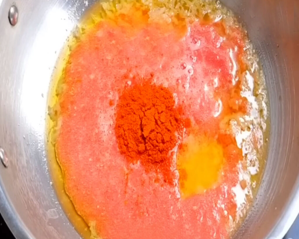Tomato puree and spices boiling in a pan to make Dal Makhani