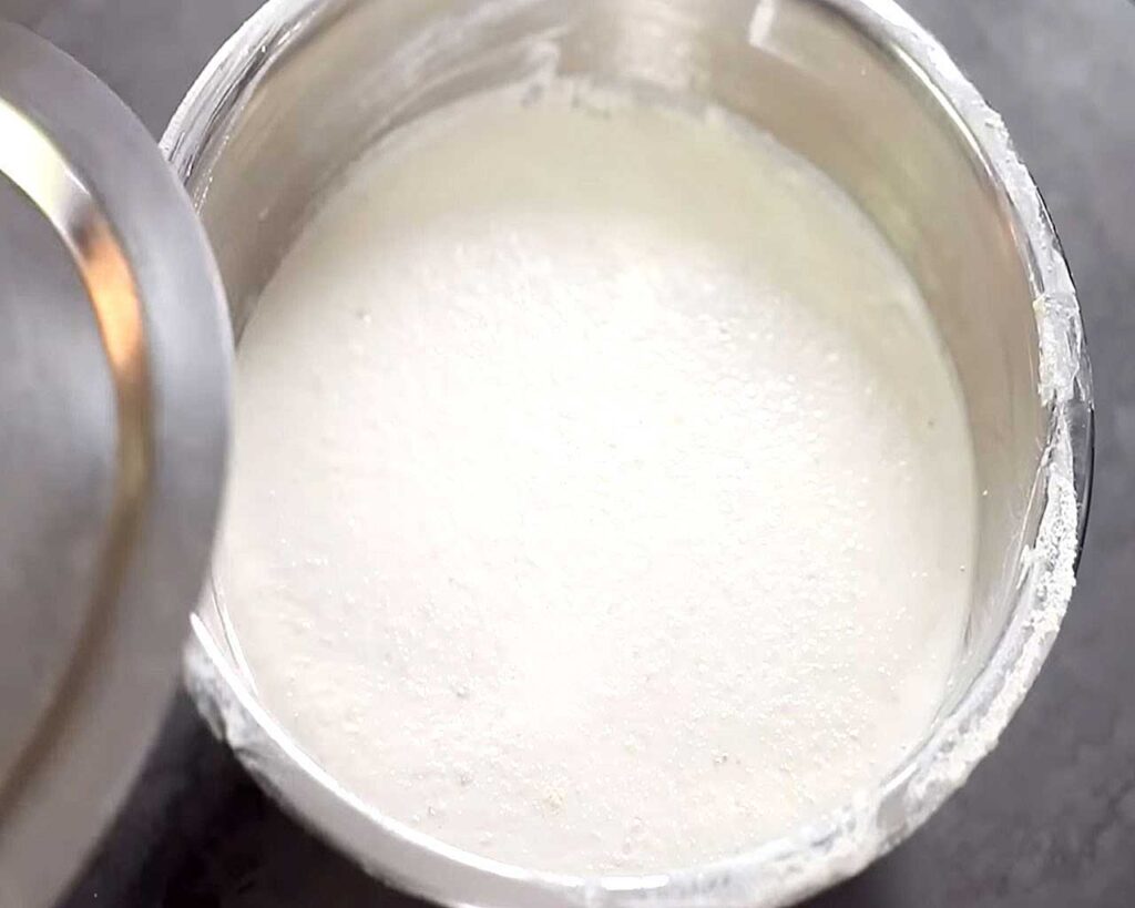Fermenting dosa batter overnight in a bowl.