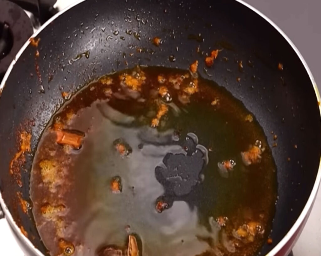 Hot oil in pan to prepare tomato paste for chicken tikka masala recipe