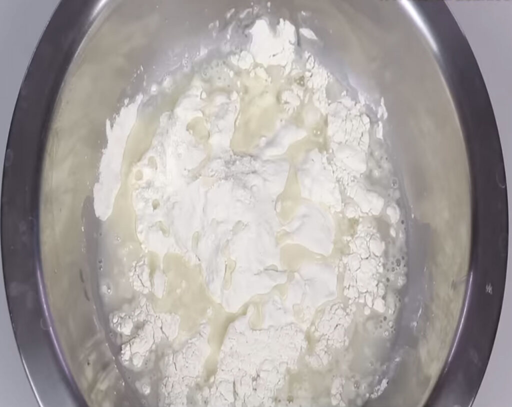 add cold water to flour to make dough for veg momos