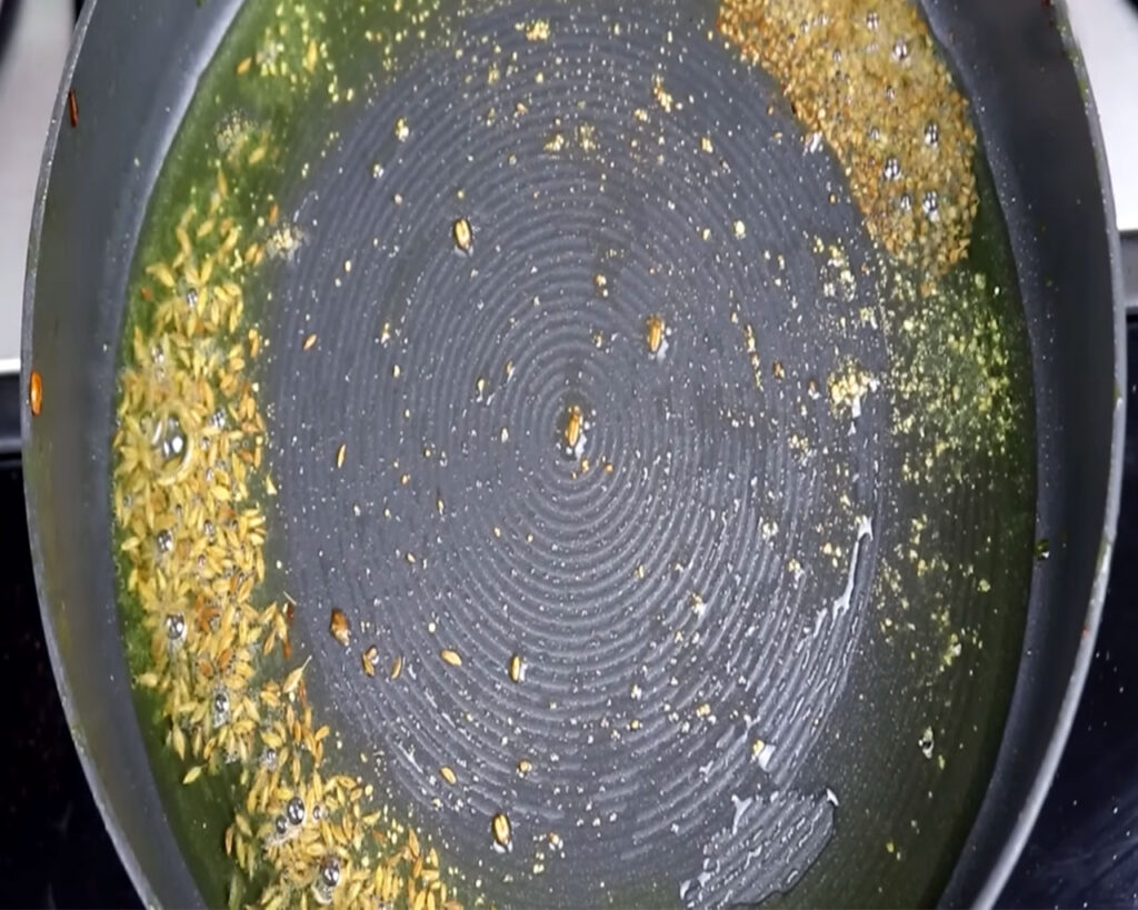 asafoetida, cumin seeds sizzle in oil