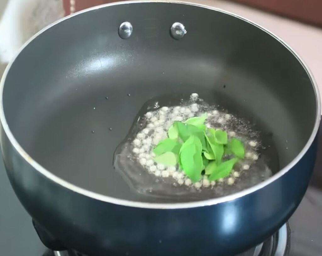Adding fresh curry leaves, chopped green chilies, and grated ginger for upma flavor