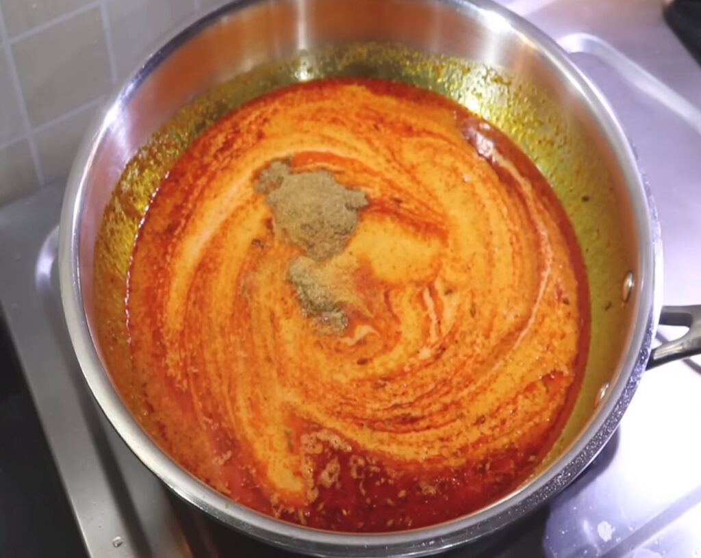 add blended paste to the pan, add coriander powder and salt