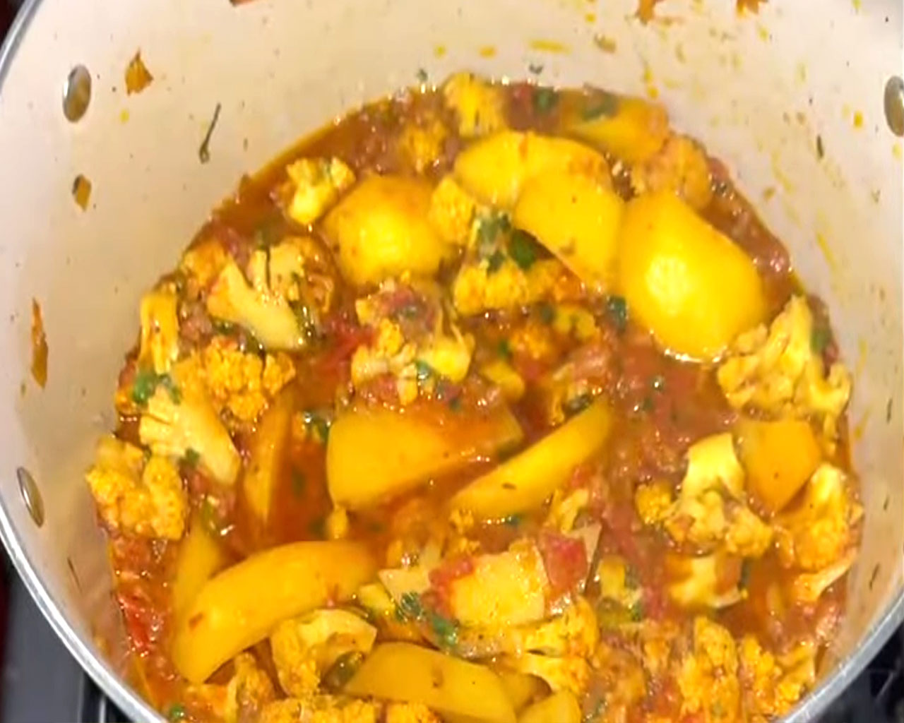 Final cooked aloo gobi garnished with coriander leaves