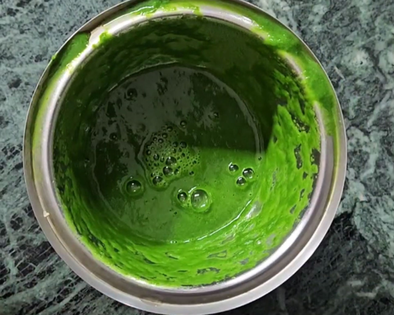 Smooth green spinach paste prepared for making Palak Paneer gravy