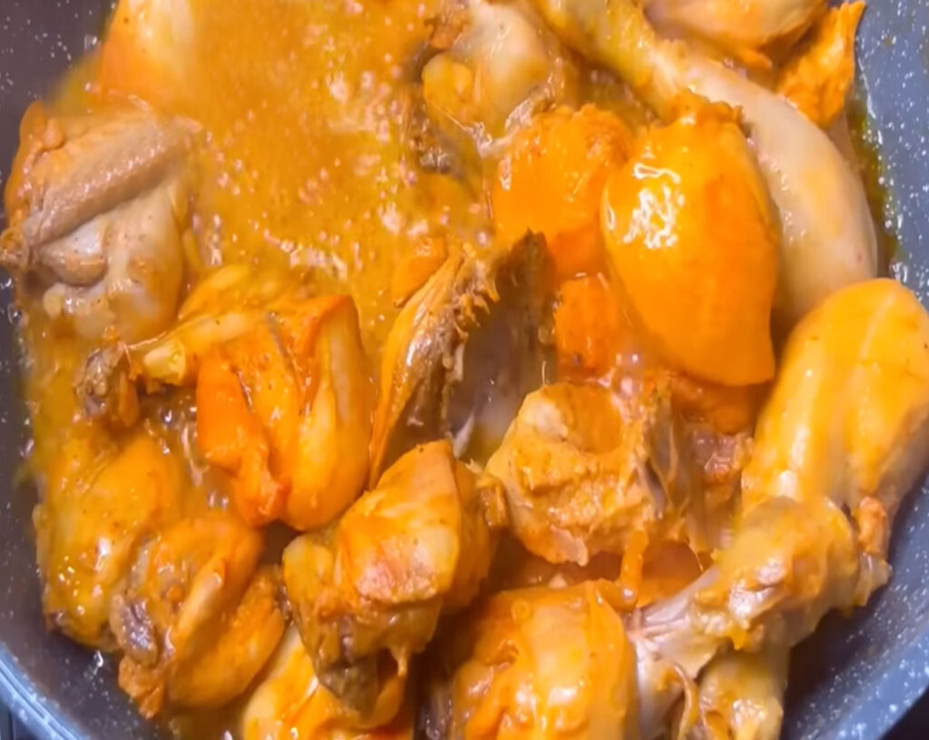 chicken pieces frying in oil for butter chicken