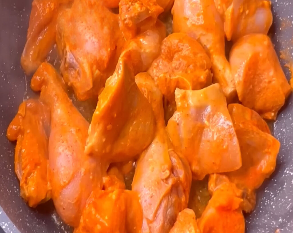 chicken pieces in pan for butter chiken