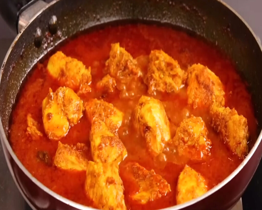 Chicken tikkas into masala sauce