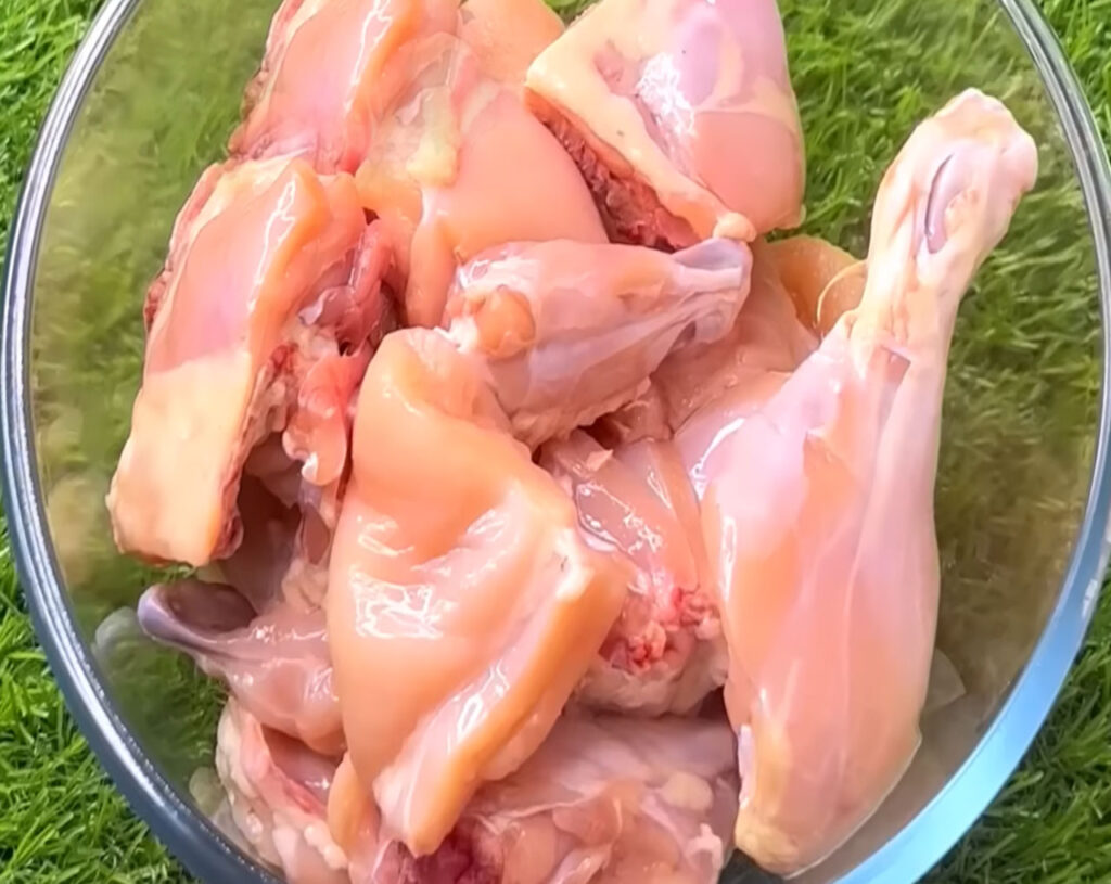 fresh chicken pieces in a bowl to make butter chicken recipe
