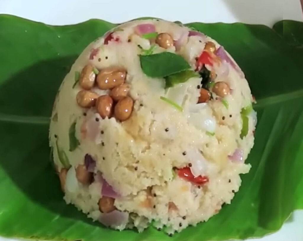 Hot upma garnished with fresh coriander leaves ready to be served