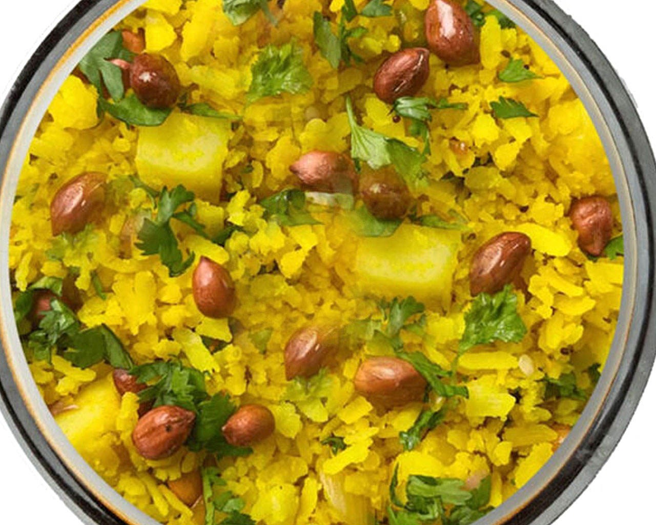 Maharashtrian Kanda Poha served hot with lemon wedge, coriander, and peanuts on top