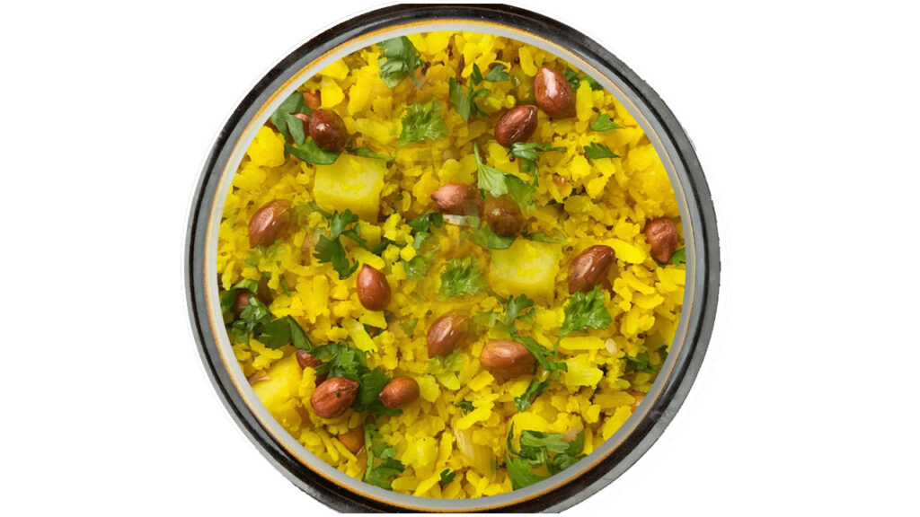 Maharashtrian Kanda Poha served hot with lemon wedge, coriander, and peanuts on top