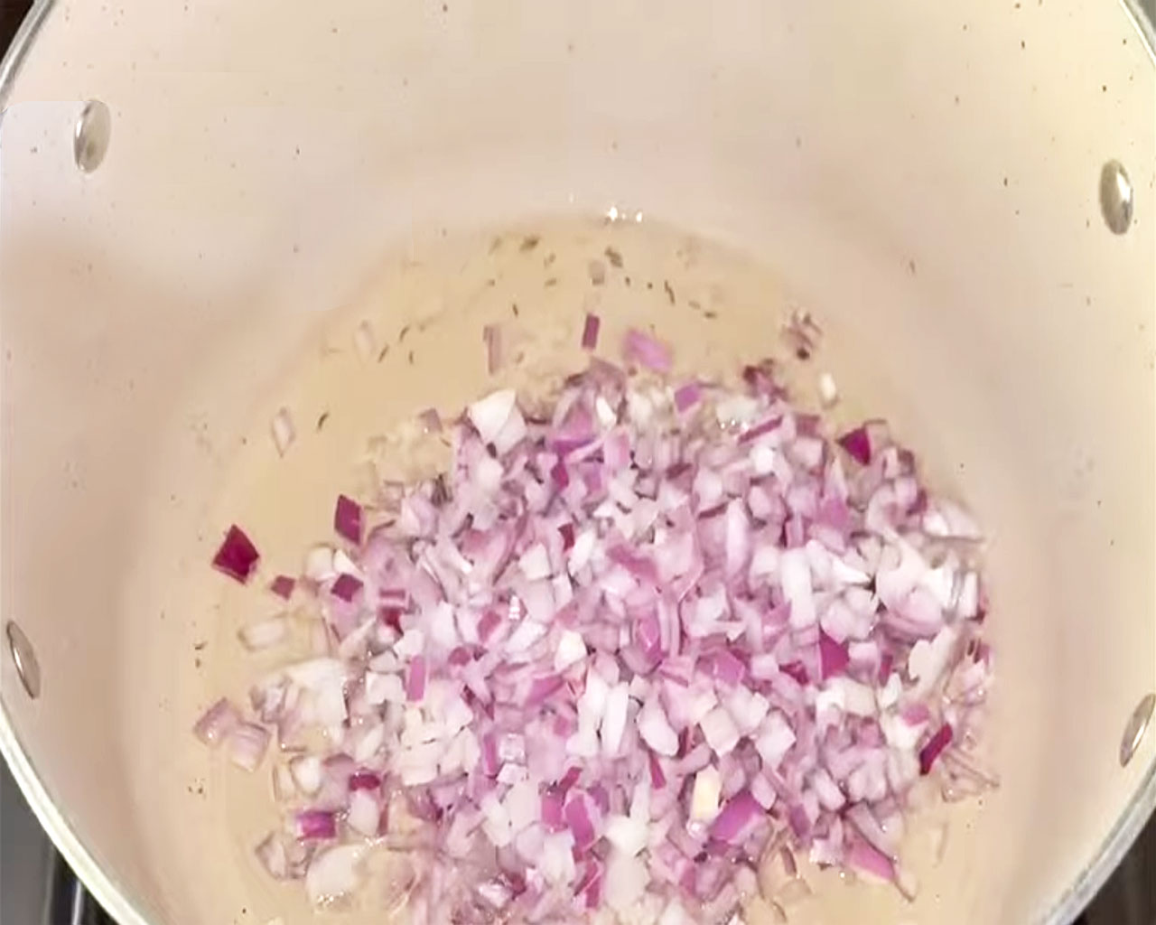 Onions sautéing in oil