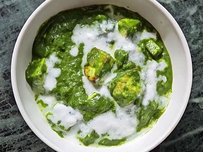 Palak Paneer garnished with fresh cream