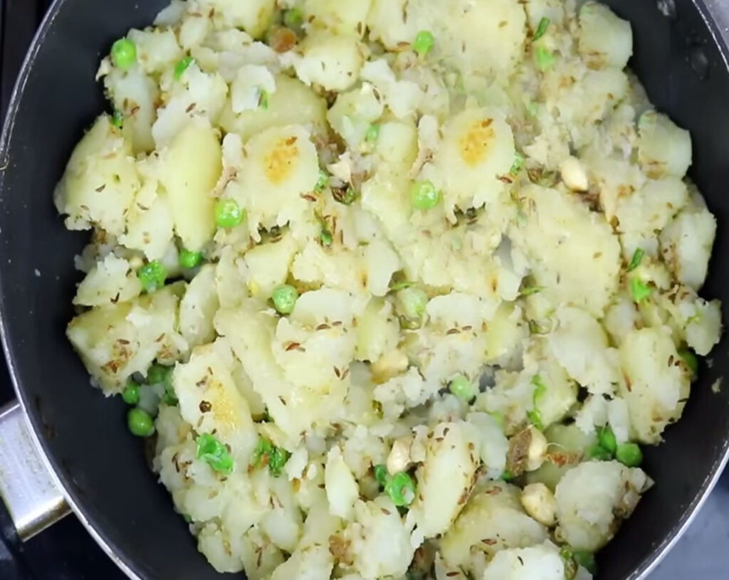 prepare samosa dough by adding boiled potatoes mashed