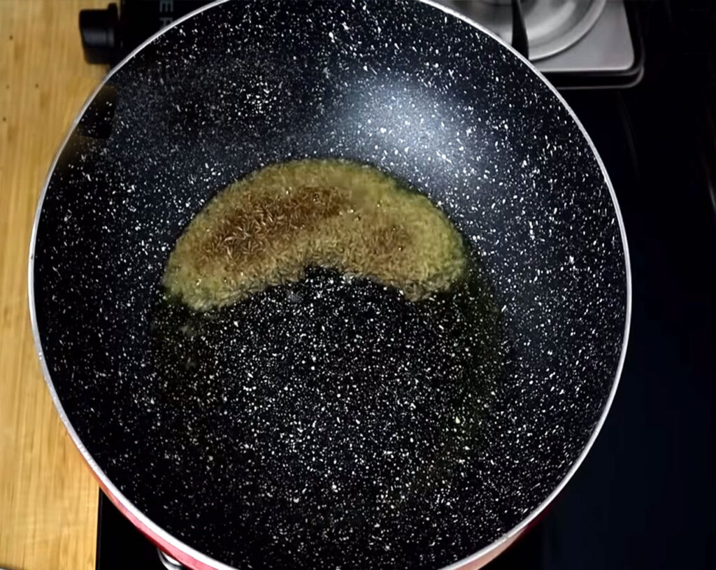 preparing jeera rice step