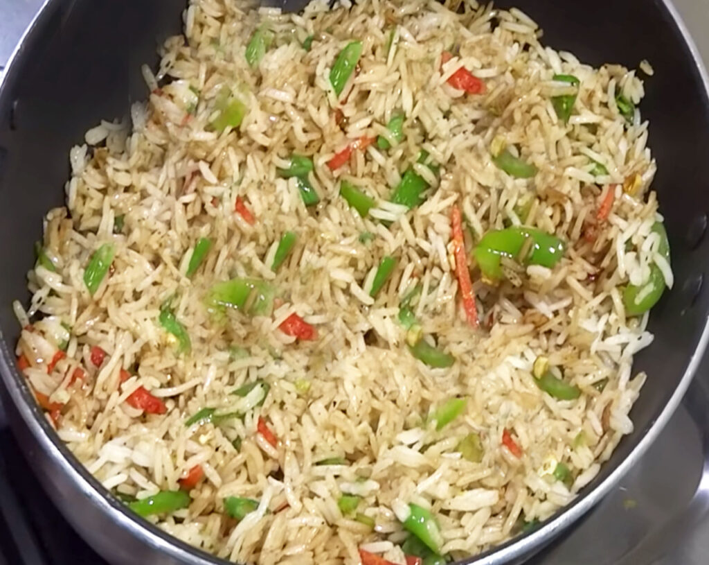 Perfectly cooked Veg Fried Rice ready to serve, with vibrant vegetables and flavors