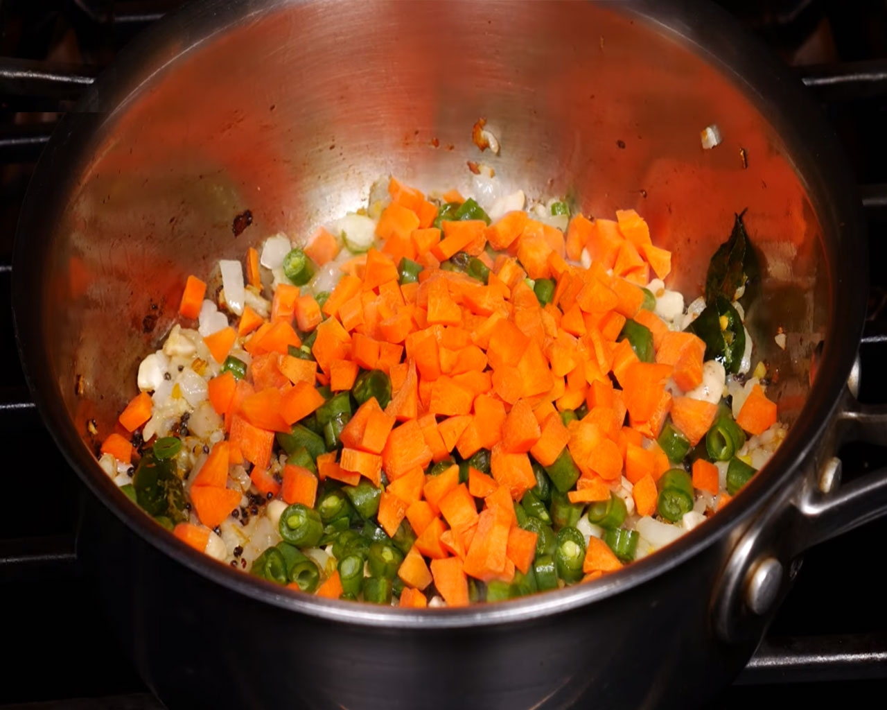 Cooking Semiya Upma with carrots