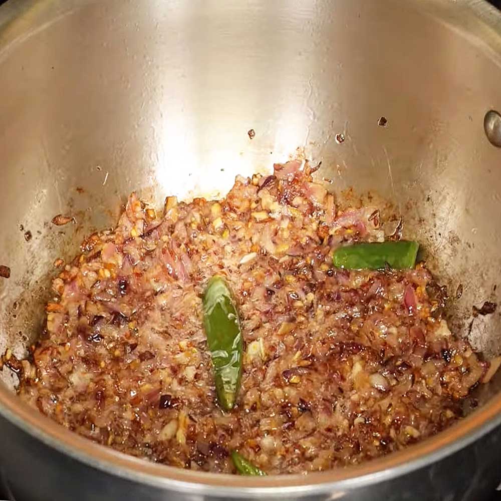 Sauteing onions in hot oil for cauliflower curry.