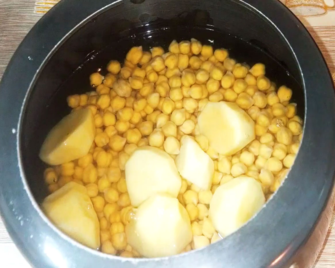 Boil chickpeas and potato in cooker for chana masala