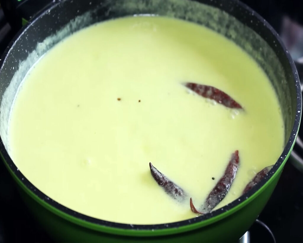 Cooking kadhi on low flame