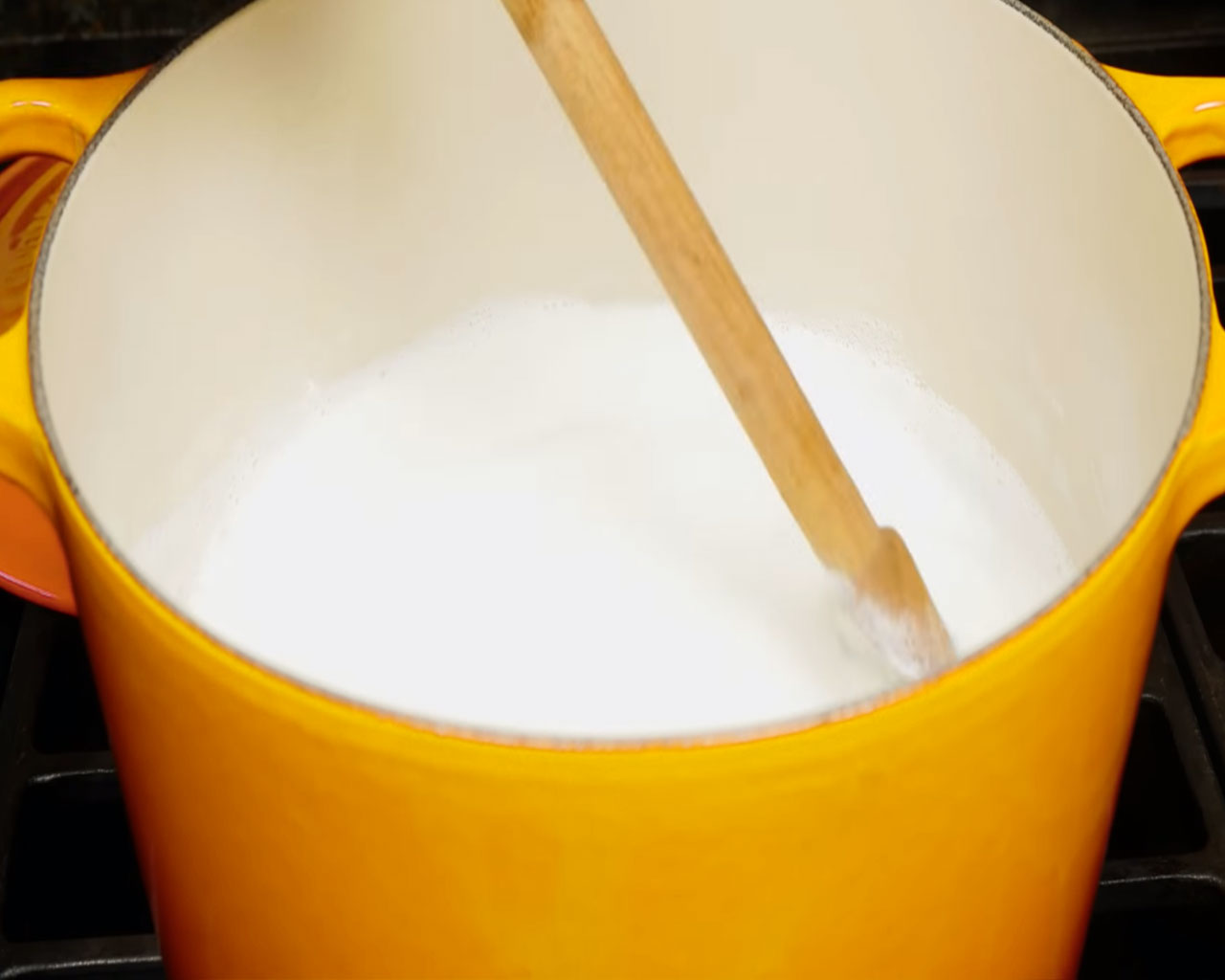 Soaked basmati rice cooking in boiled milk to make rich and creamy homemade kheer.