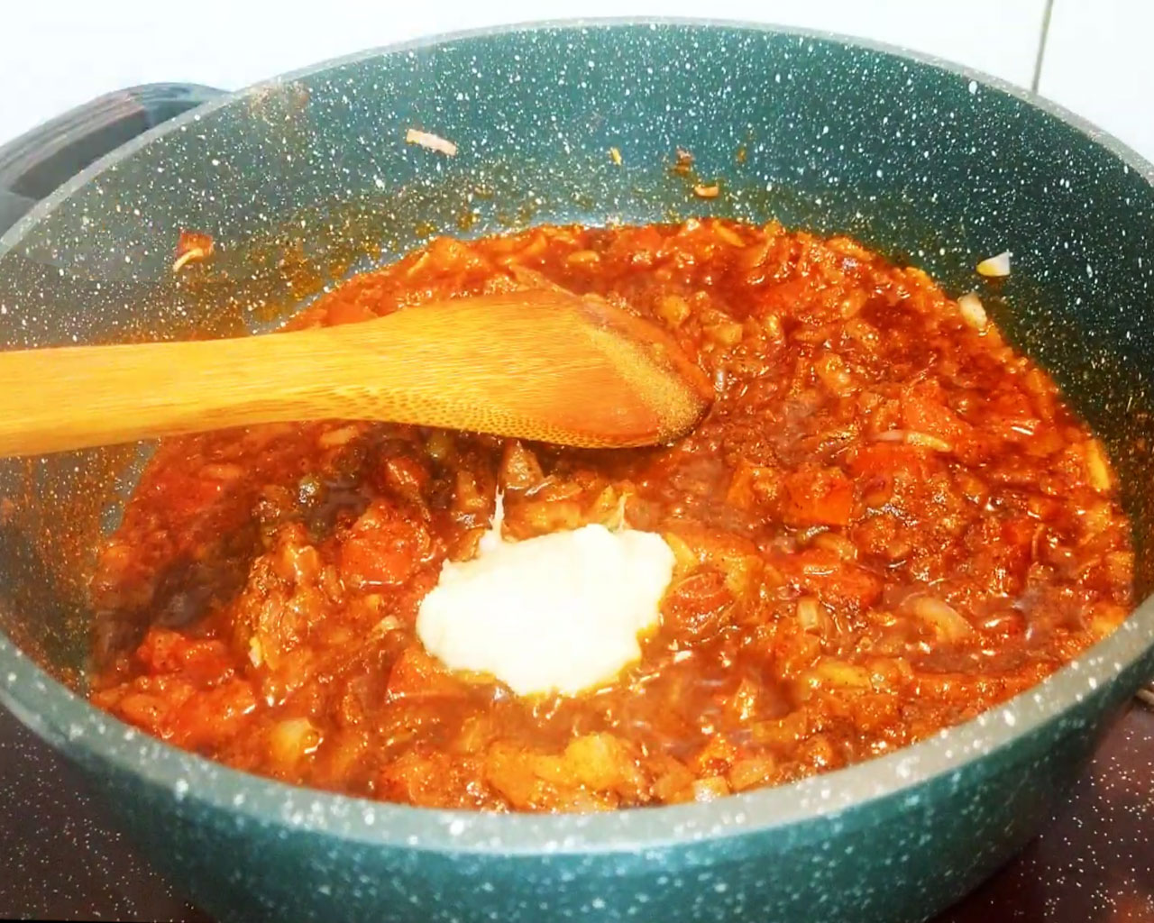 Ginger garlic paste and water mixed into the spiced gravy