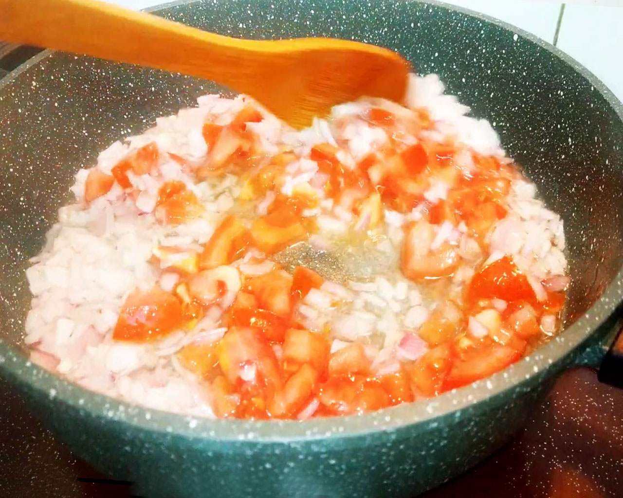 Sauteing onions and tomatoes to make onion tomato base for Chana Masala curry