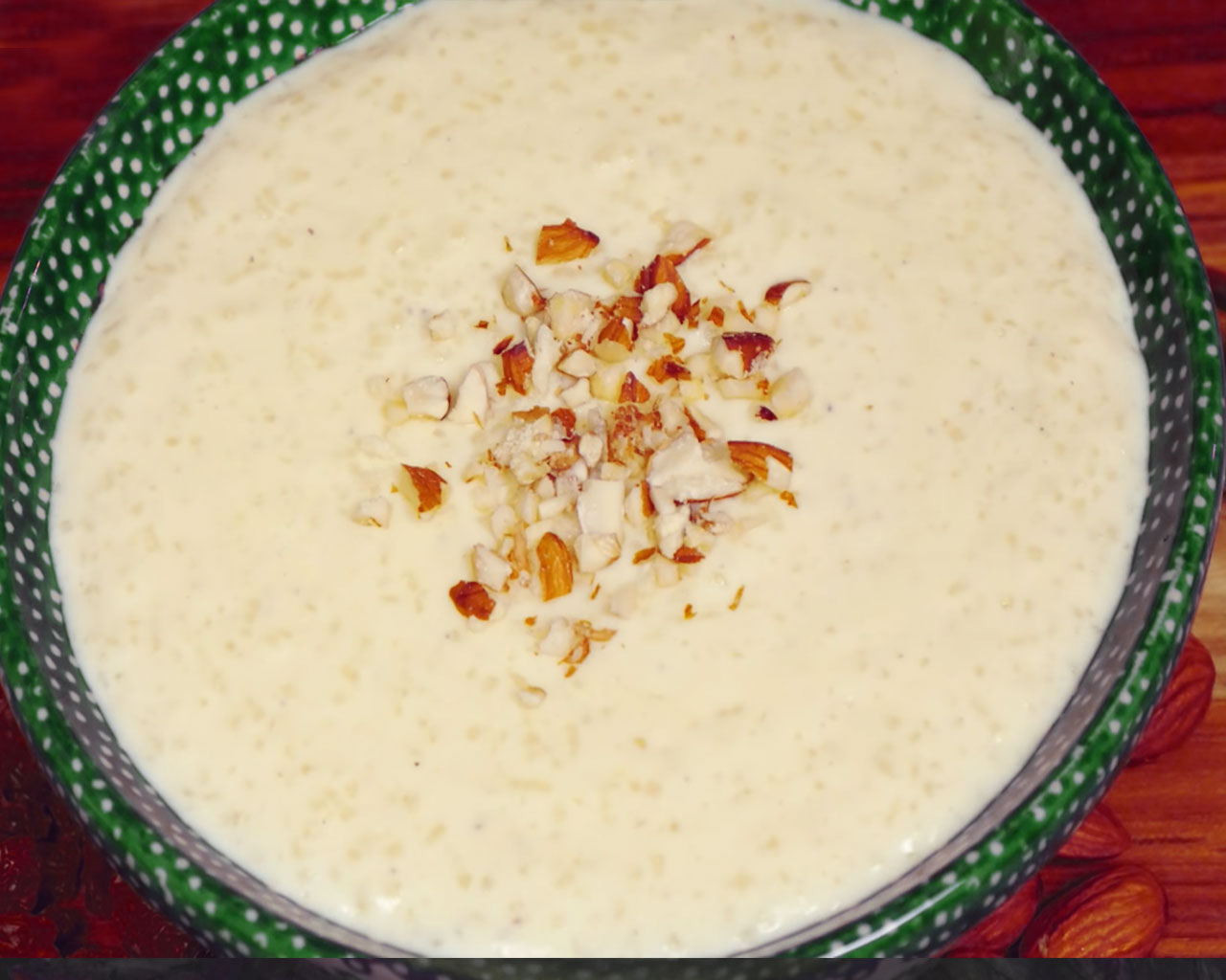 Hot and creamy rice kheer garnished with nuts, ready to be served as a traditional Indian dessert.