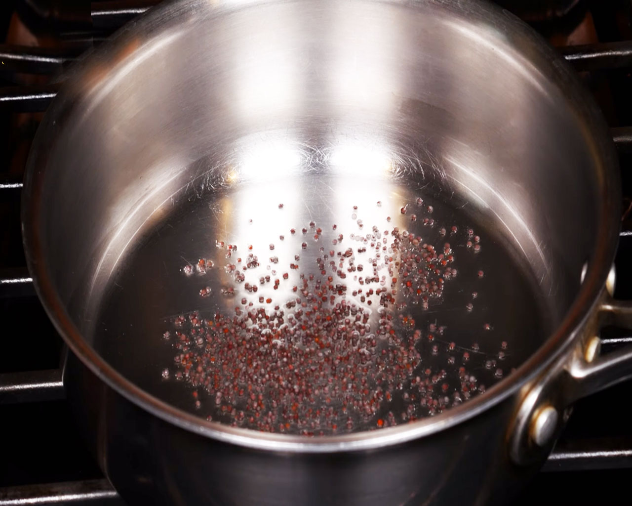 Mustard seeds popping in hot coconut oil