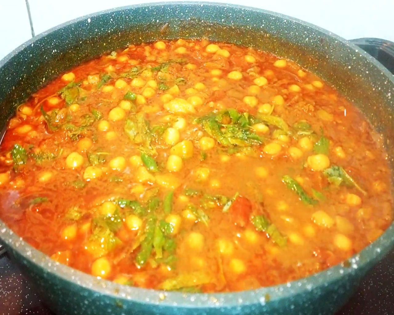 Chana masala recipe garnished with mint leaves