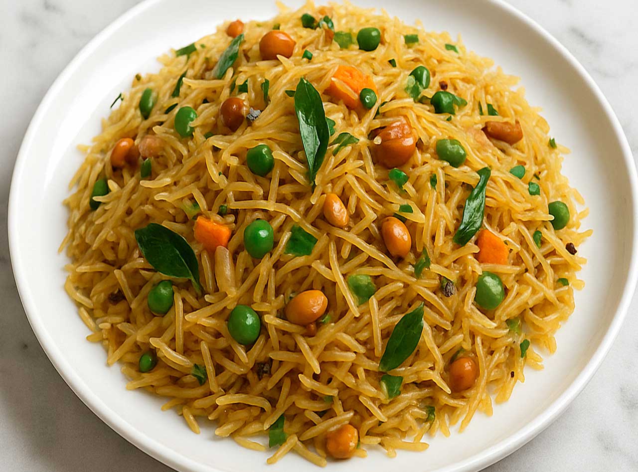 Traditional South Indian Semiya Upma on a white plate, garnished with curry leaves served for breakfast.