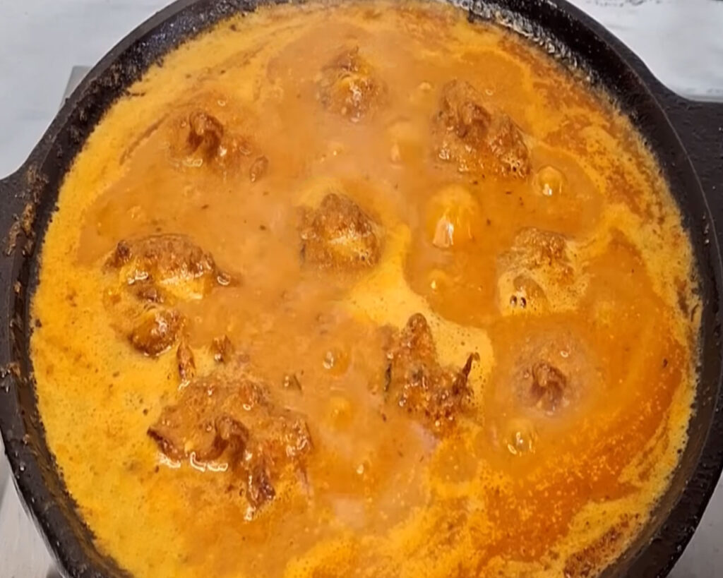 Veg kofta cooking in curry