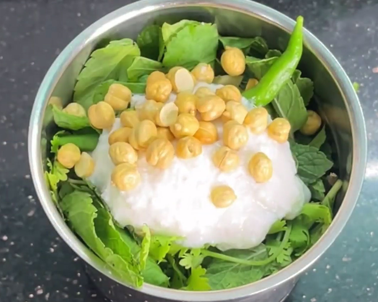Roasted chana dal added to chutney mix in grinder jar