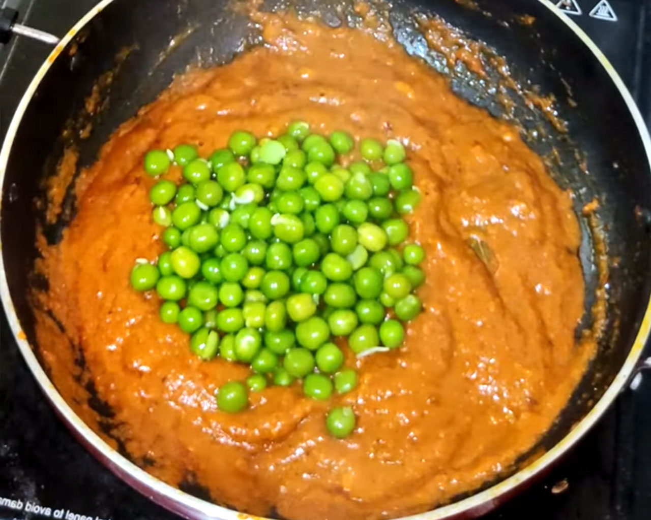 Green peas added to the simmering matar paneer gravy to infuse flavor