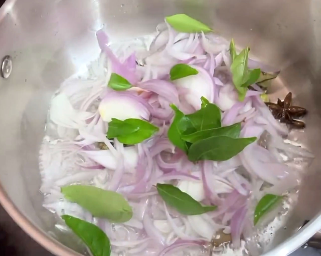 Curry Leaves being cooked with onions for Veg Kurma