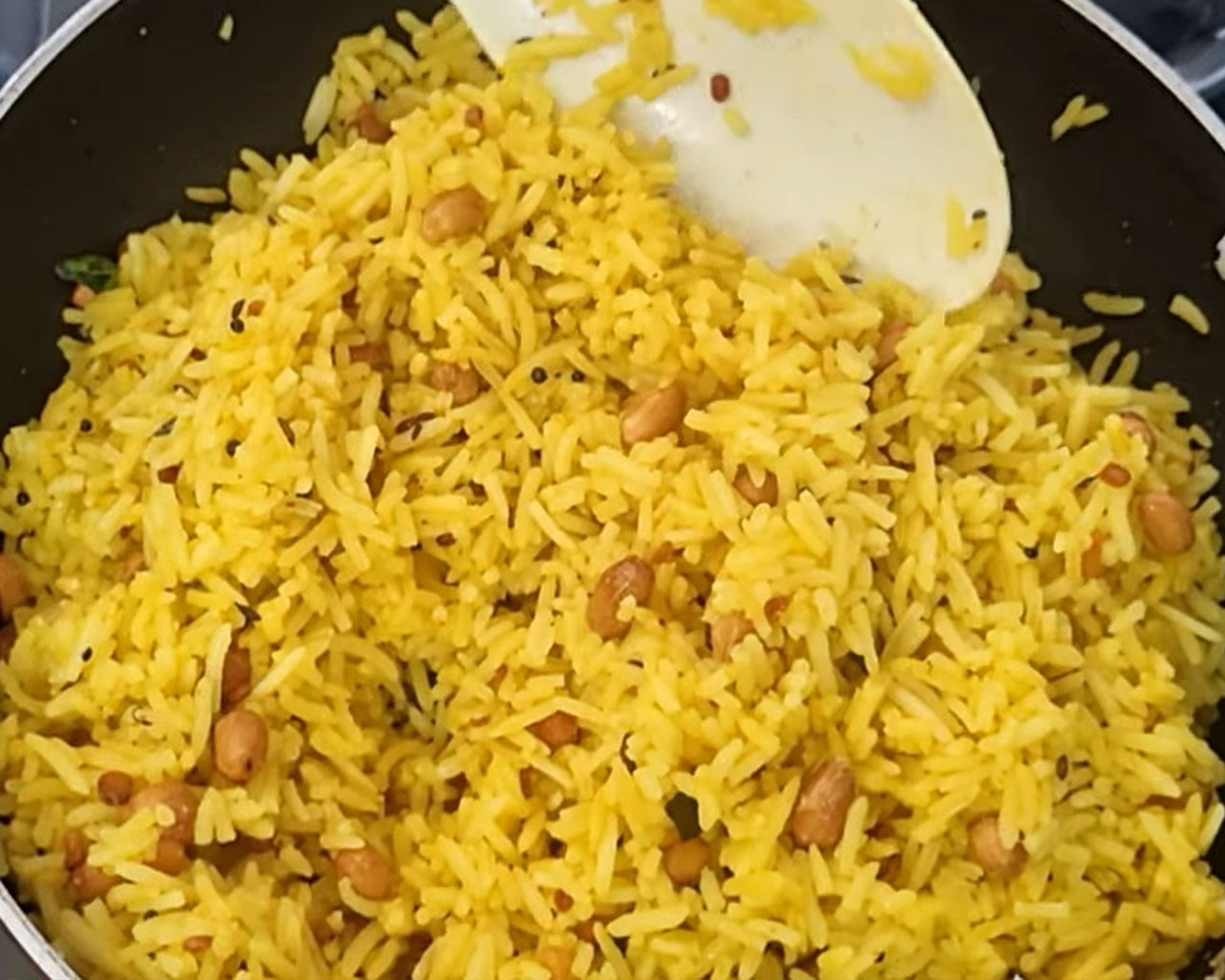 Final lemon rice stirred and resting for flavor to blend