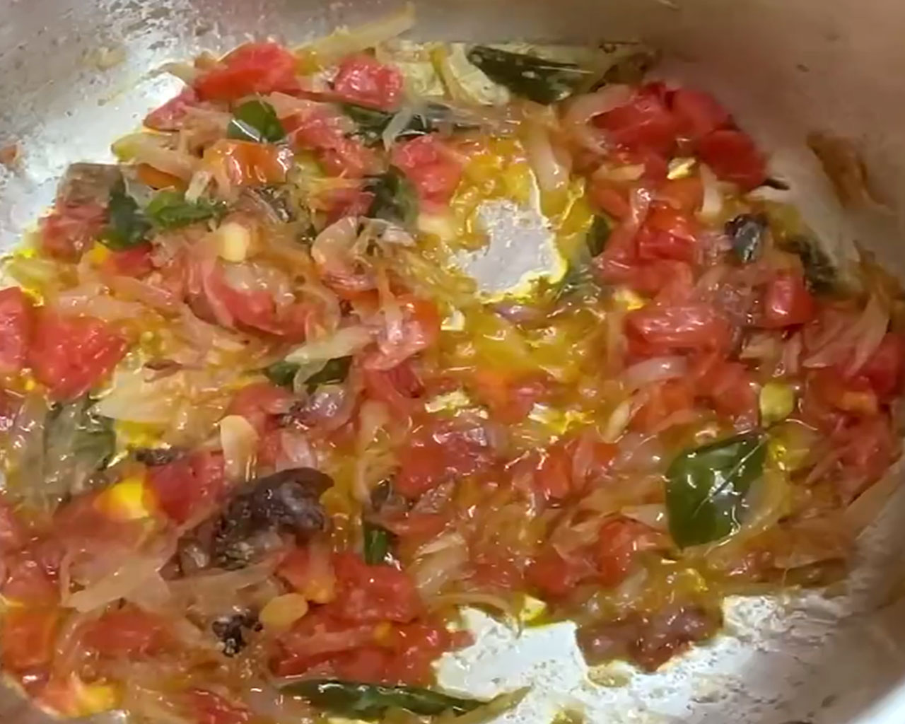 Onion and tomato sautéed to a thick, soft consistency, forming the base for South Indian vegetable kurma