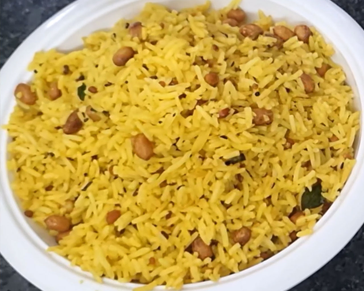 Garnished lemon rice Chitranna served in a bowl