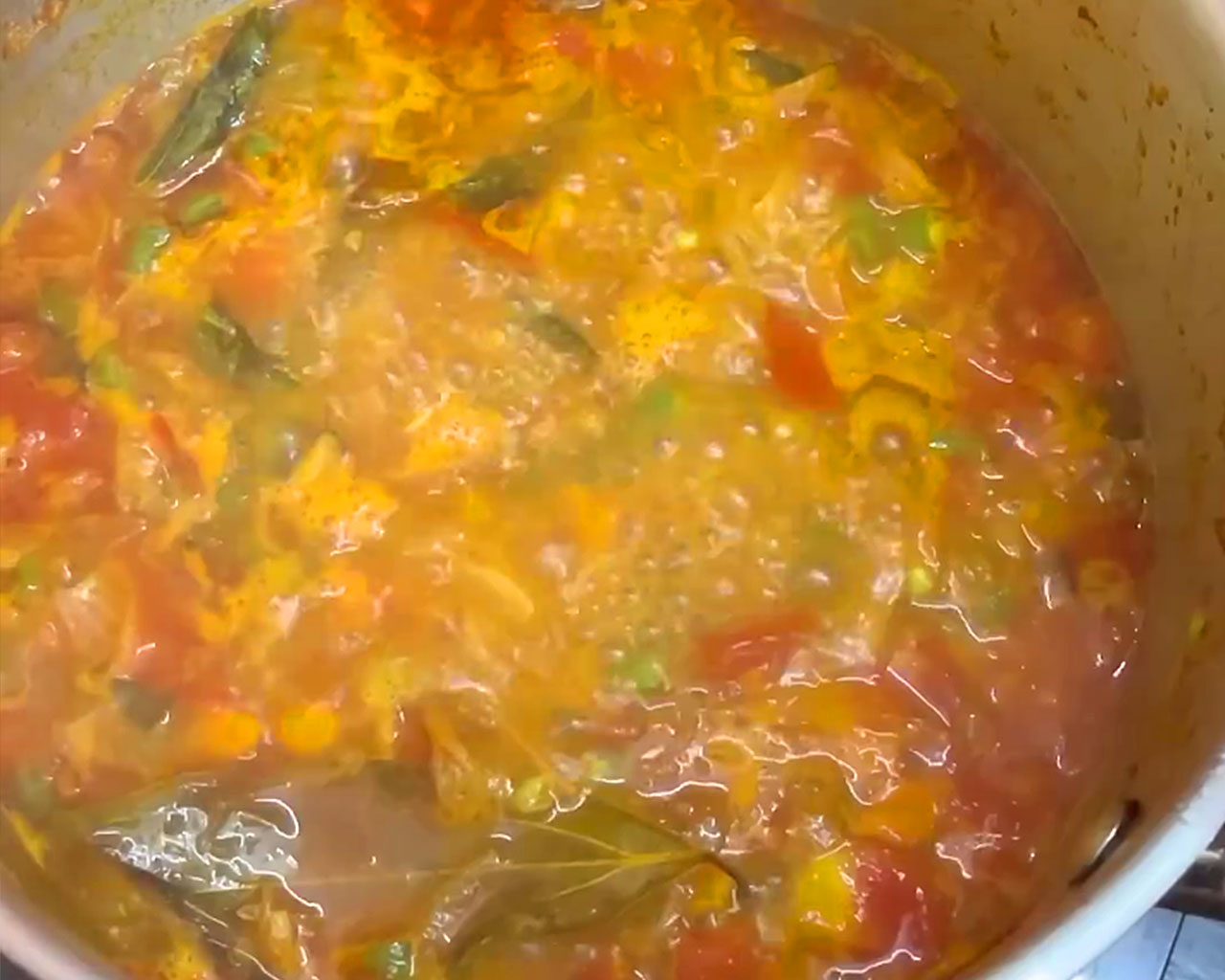 Vegetable kurma cooking on low flame