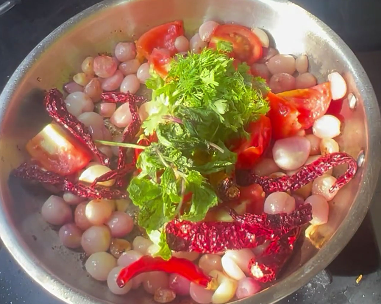 Turmeric, cumin seeds, and coriander leaves added to enhance flavor