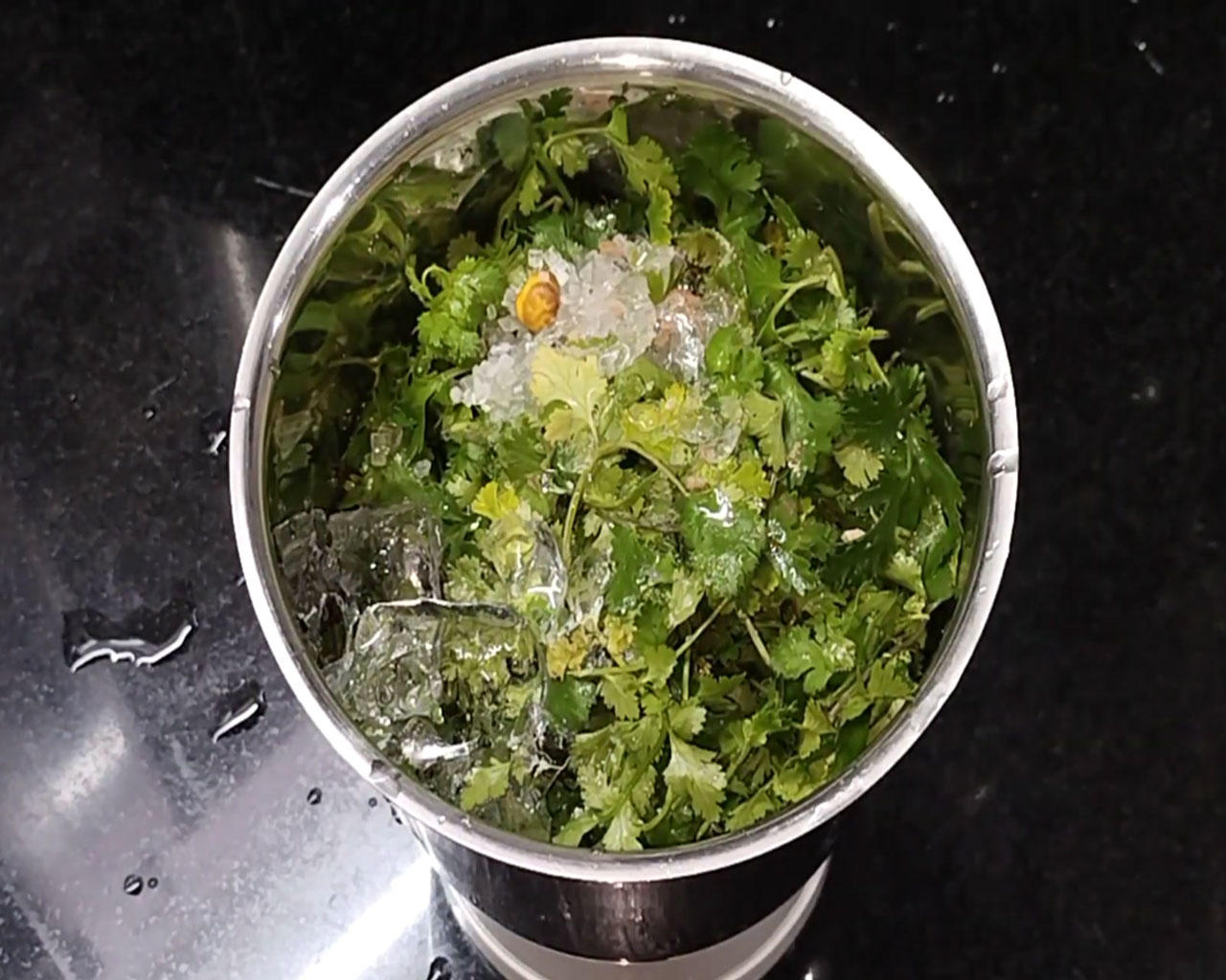 Adding water for coriander chutney