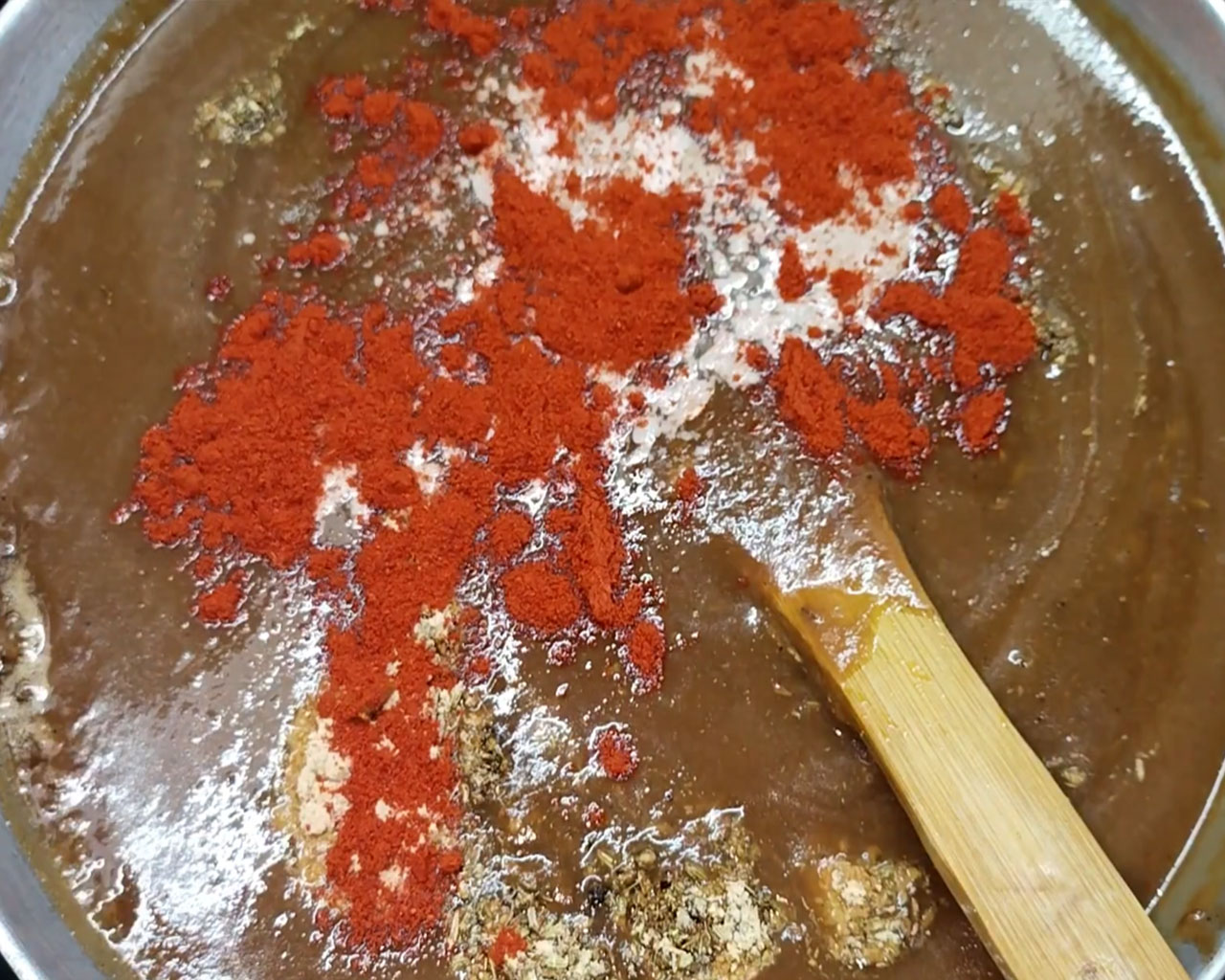Adding black salt and red chili powder for spicy and tangy chutney
