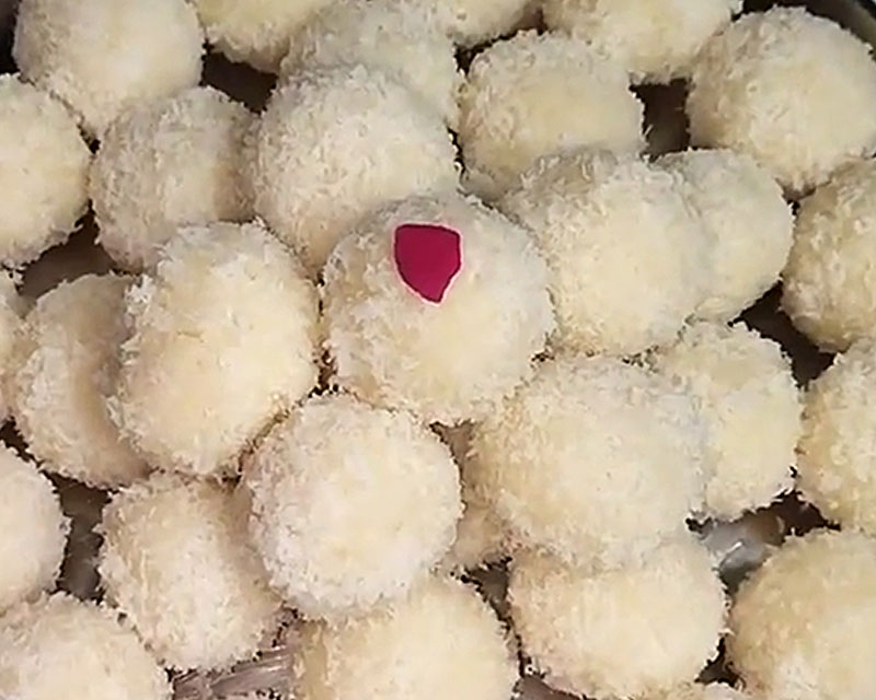 Garnished coconut ladoo in a plate