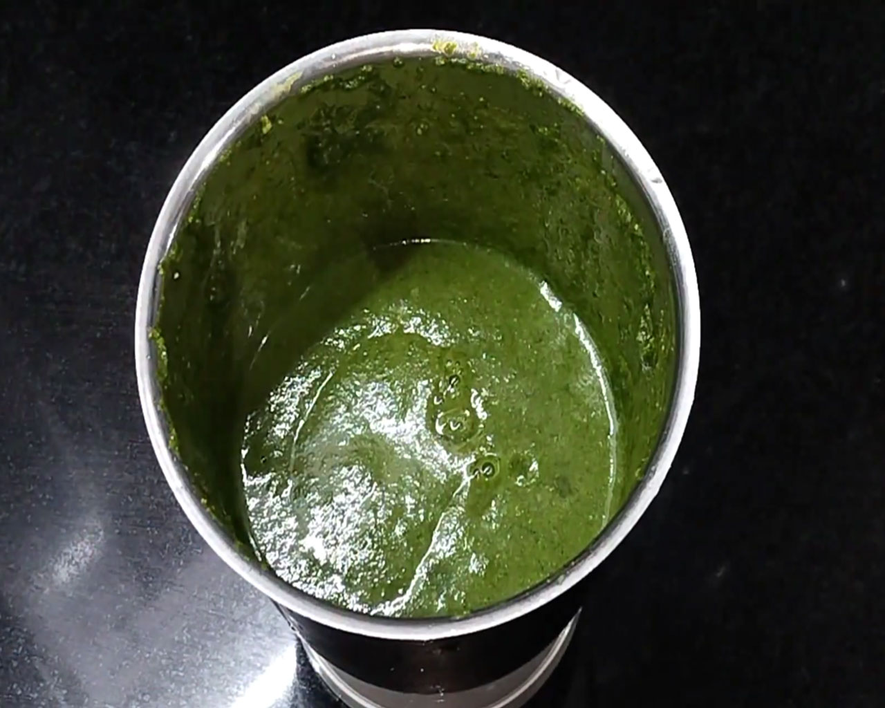 Lime juice added to coriander chutney in jar