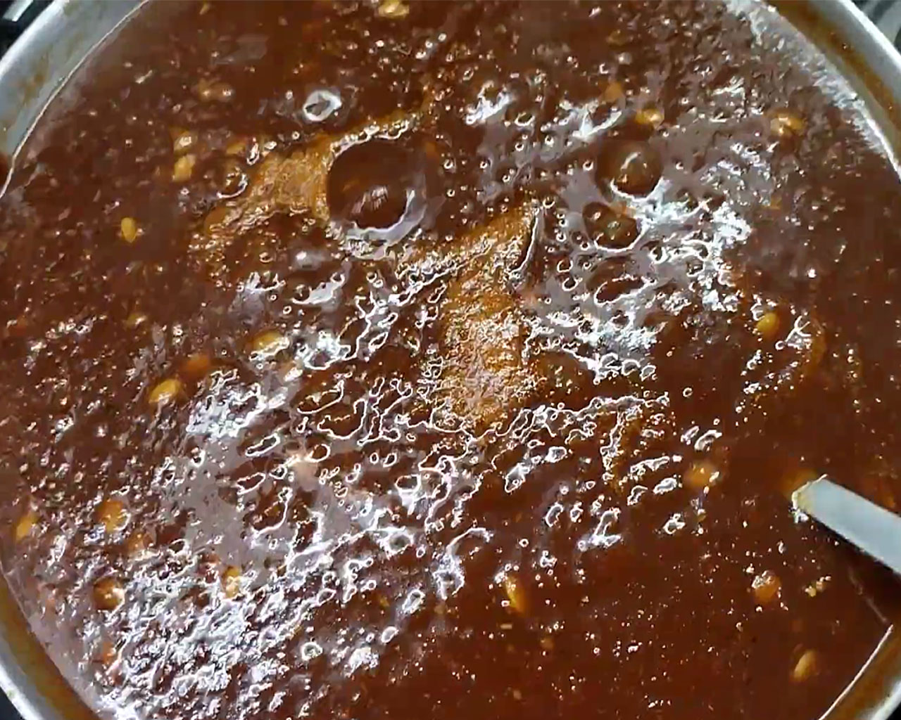 Tamarind chutney garnished with melon seeds