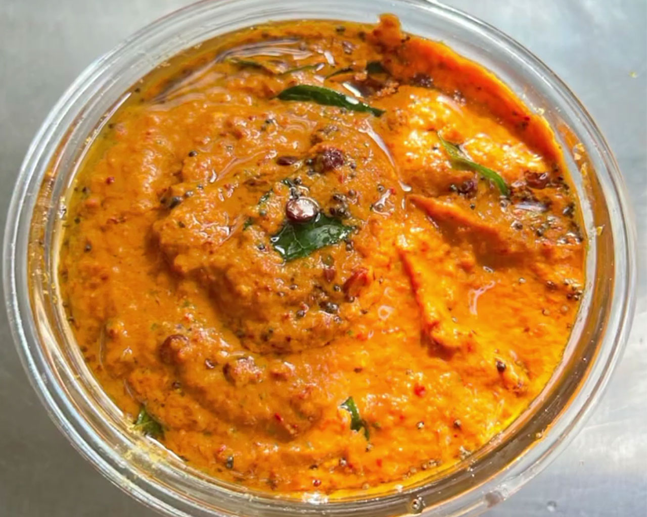 Spicy South Indian onion chutney served in a glass bowl, perfect as a side for dosa, idli, and rice