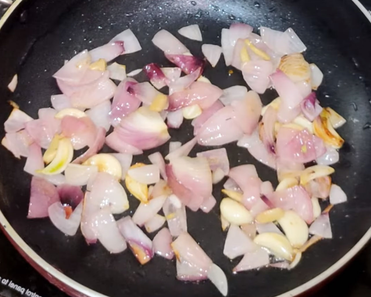 Sauteing ingredients to make paste for matar paneer